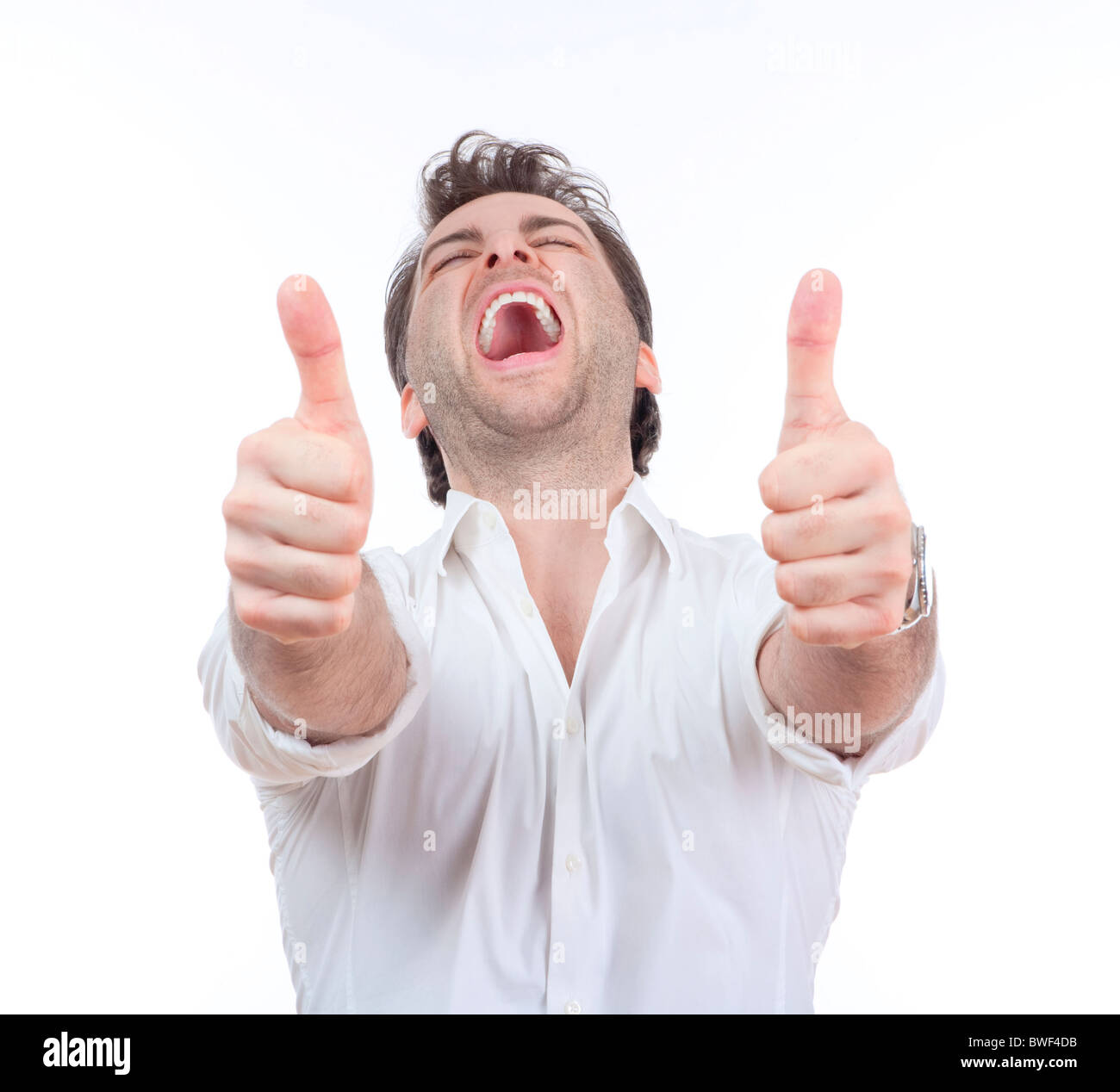 excited man laughing holding his both thumbs up - isolated on white Stock Photo