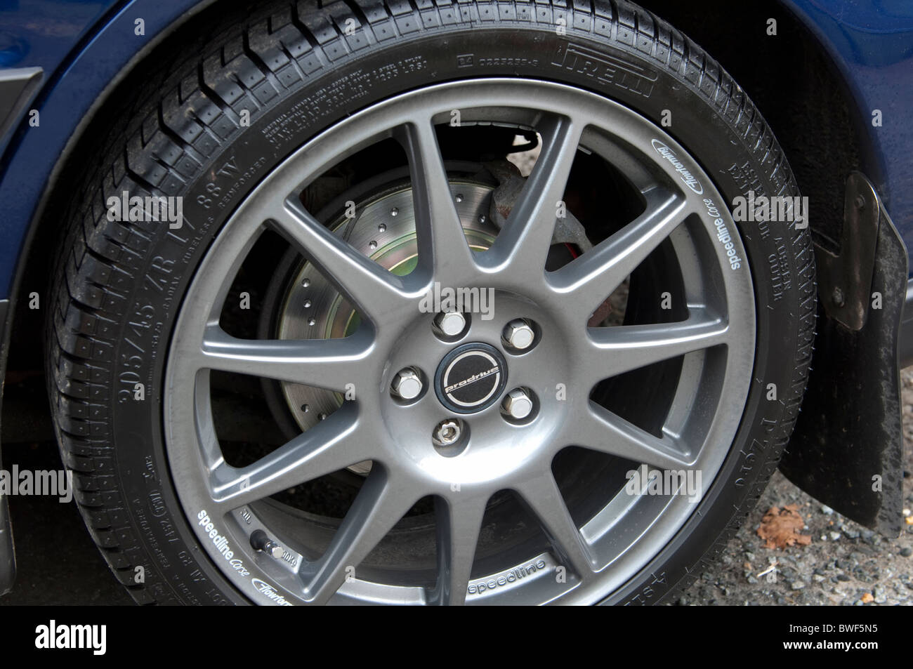 Vented and dimpled brake disc and alloy wheel Stock Photo