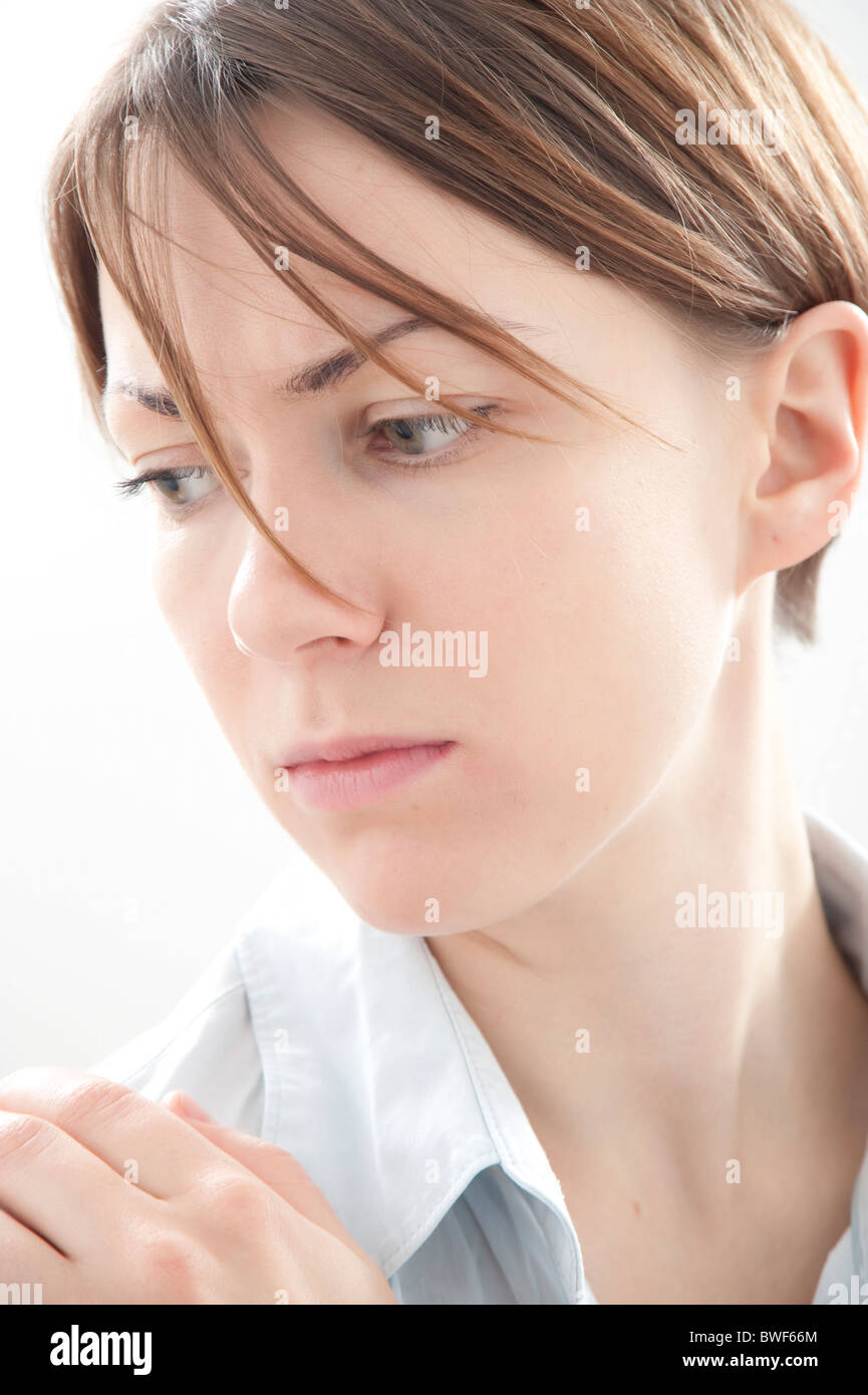 woman looking away, worried Stock Photo