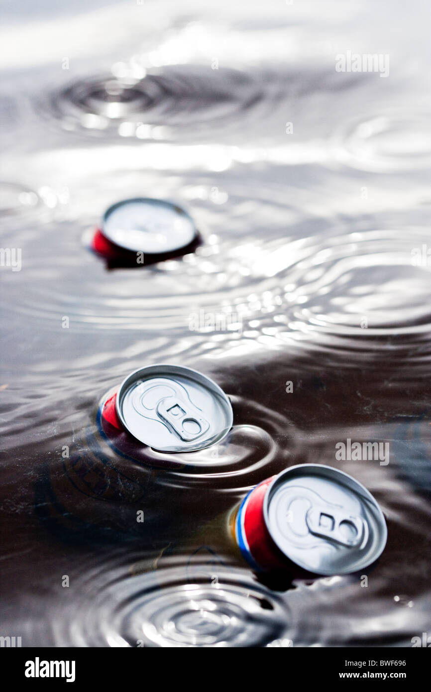 Cans of beer floating in the water,Sweden Stock Photo