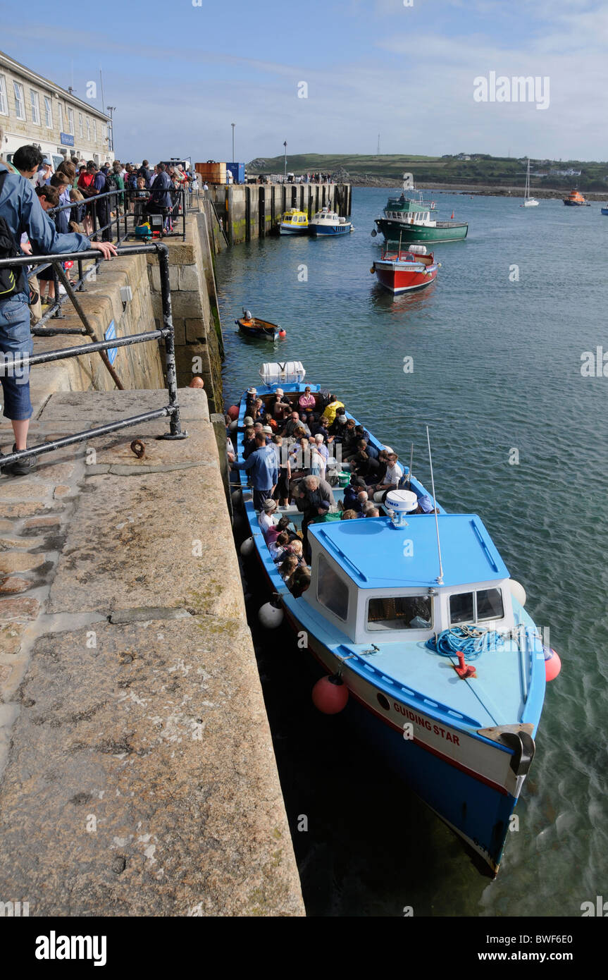 A boat collecting daytrippers for a day trip to the nearby islands in