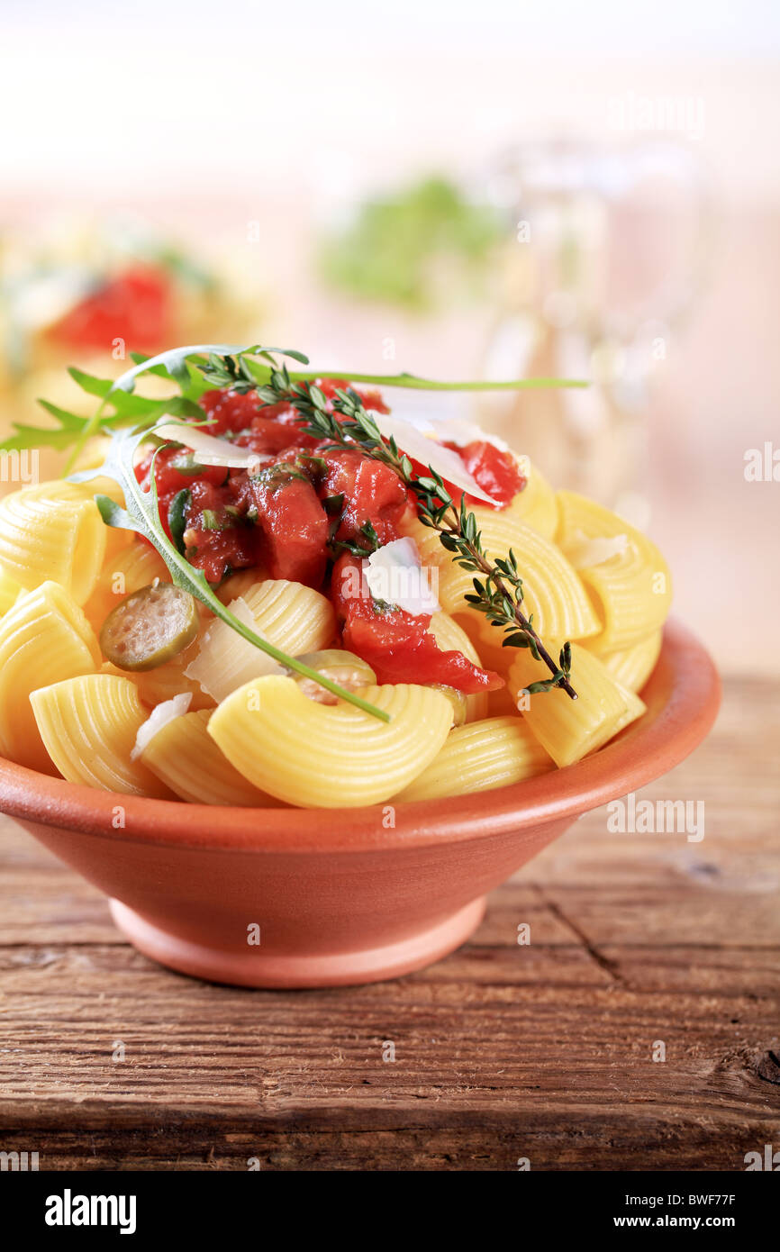 Bowl of pasta with crushed tomato and Parmesan Stock Photo Alamy