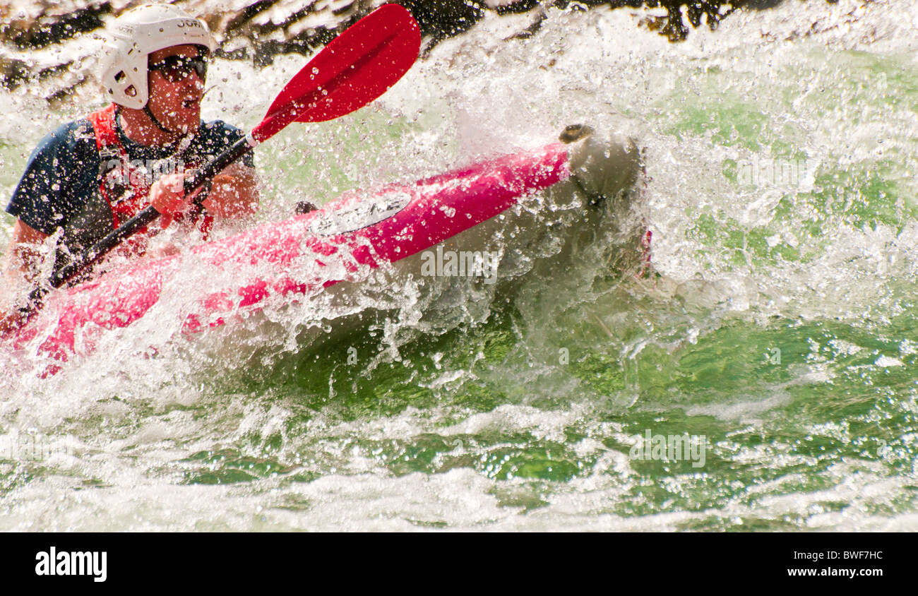 USA,Idaho, Rafting Middle Fork of the Salmon River. Man paddling kayak through churning whitewater rapids. Stock Photo