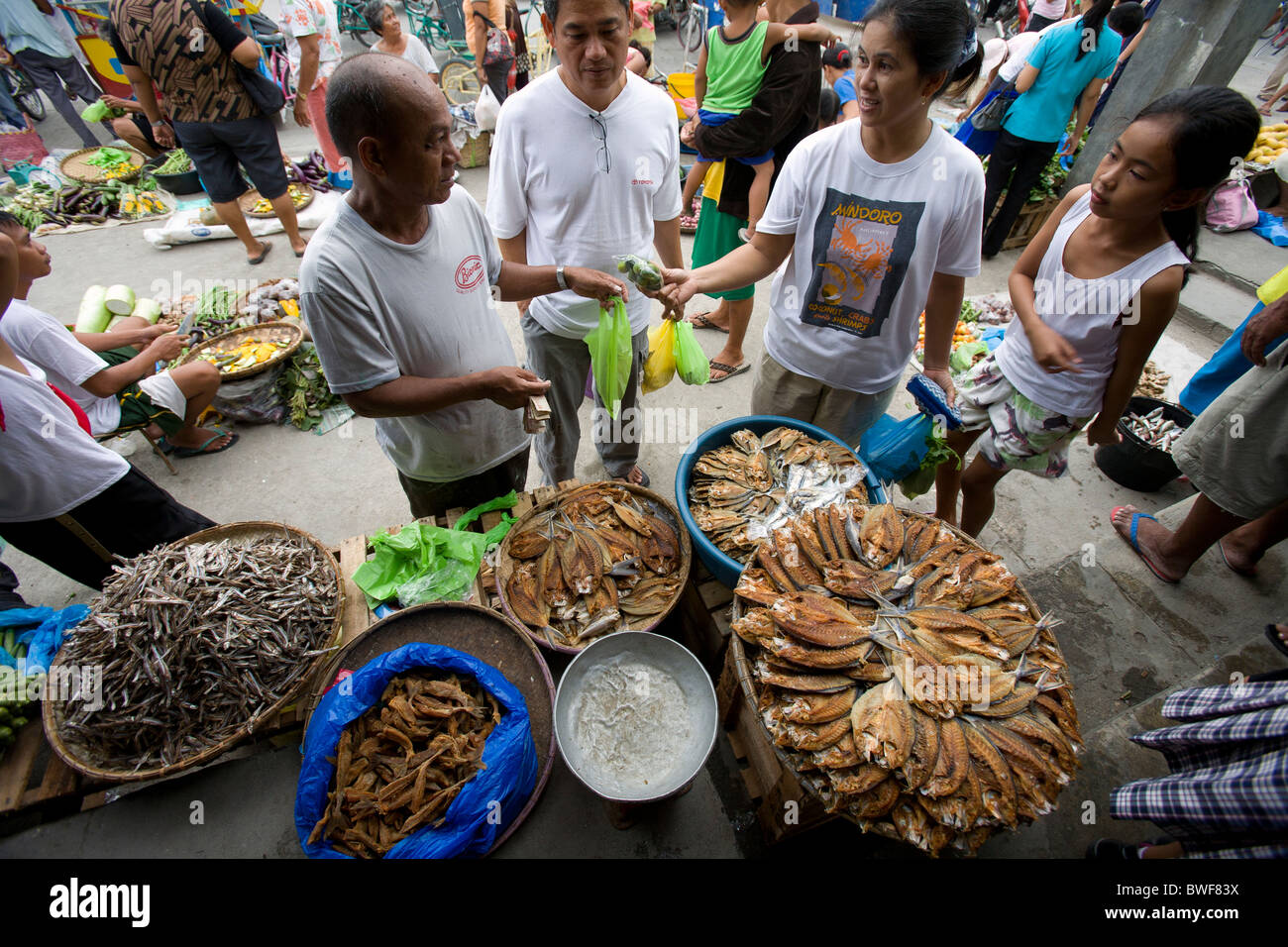 A tuyo, or dried fish, vendor conducts business at a market in Roxas