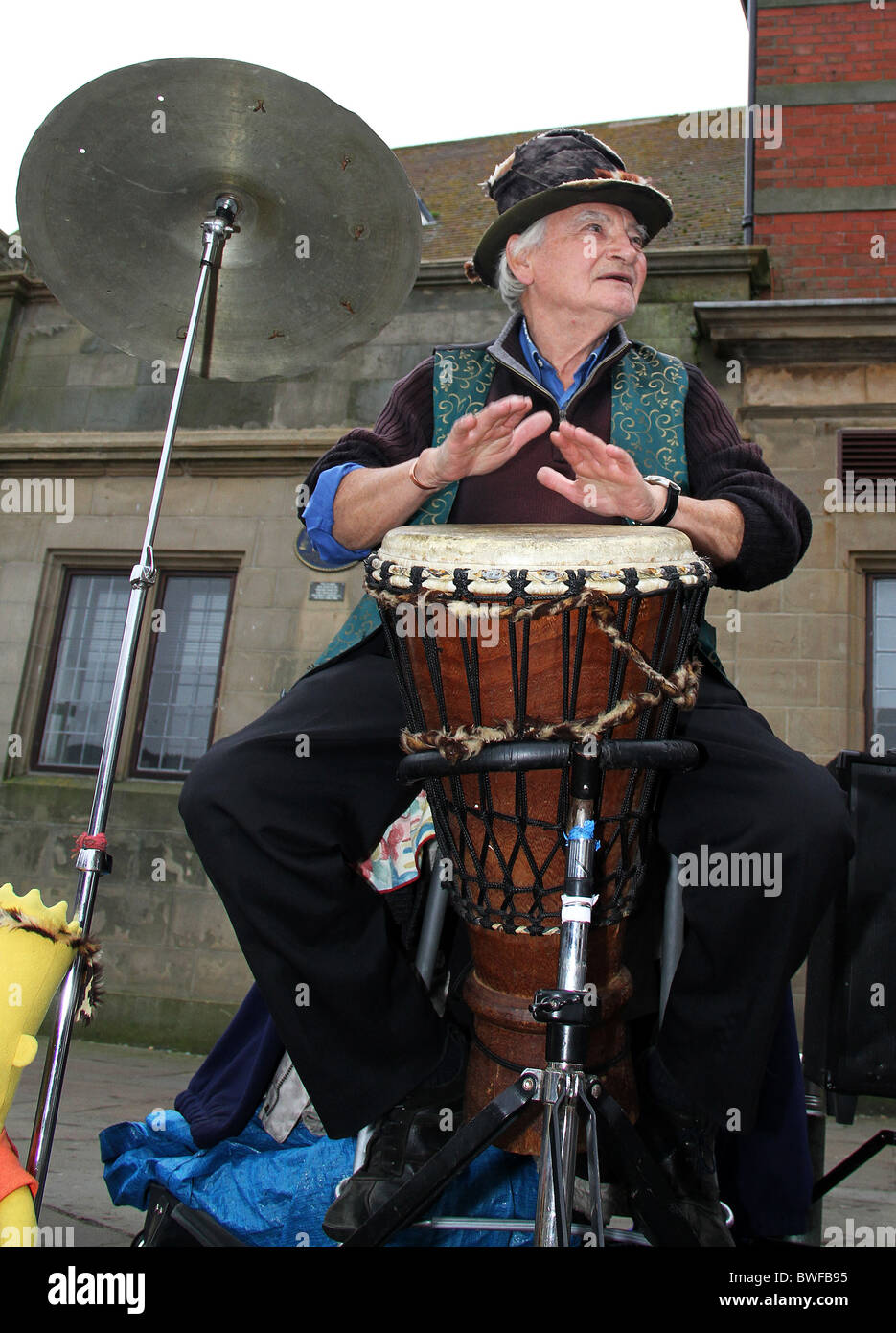 Man playing bongo drum in open street at Goth weekend in Whitby Stock Photo Alamy