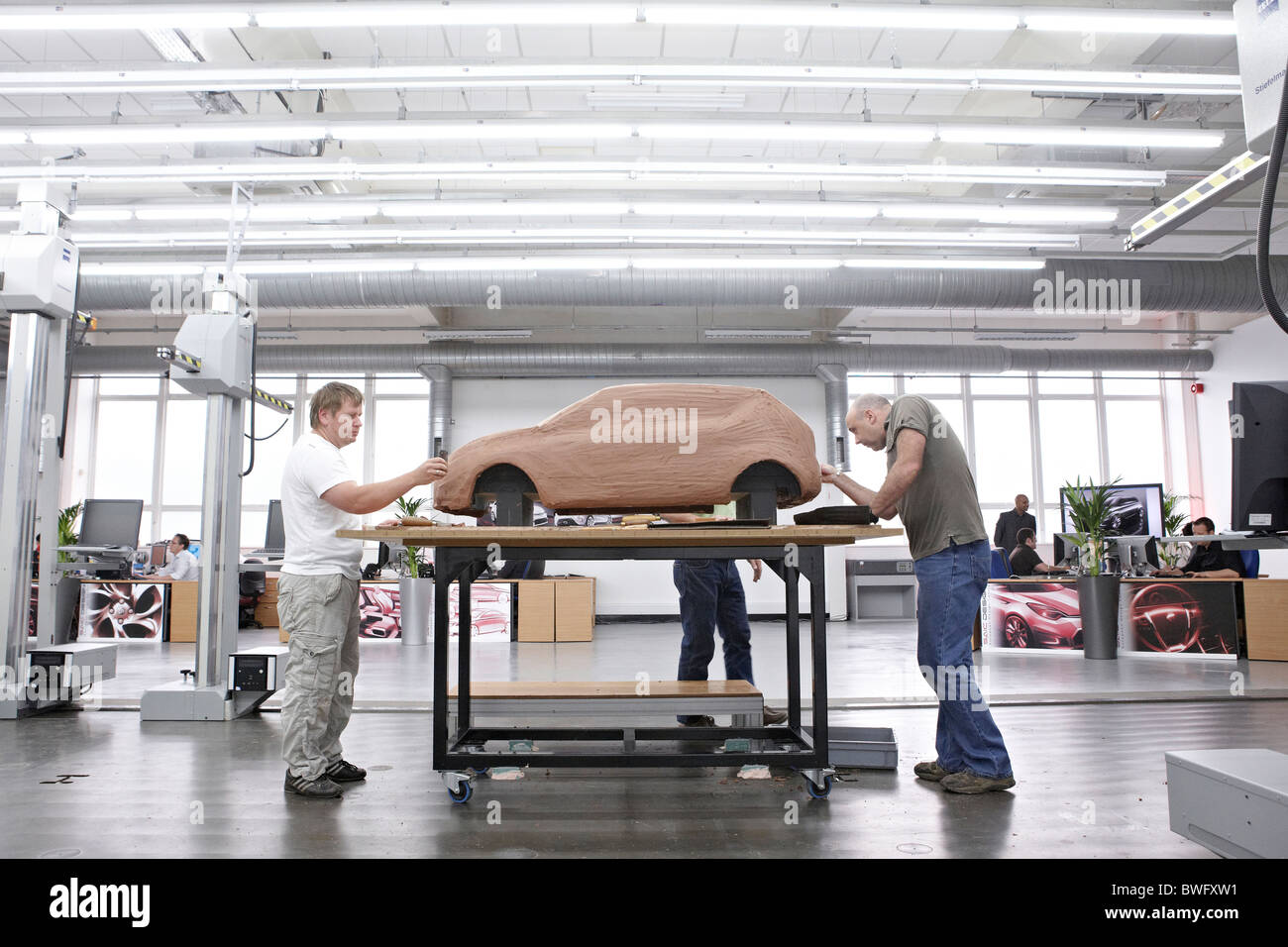 Technicians inside the MG car plant in Longbridge, Birmingham work on