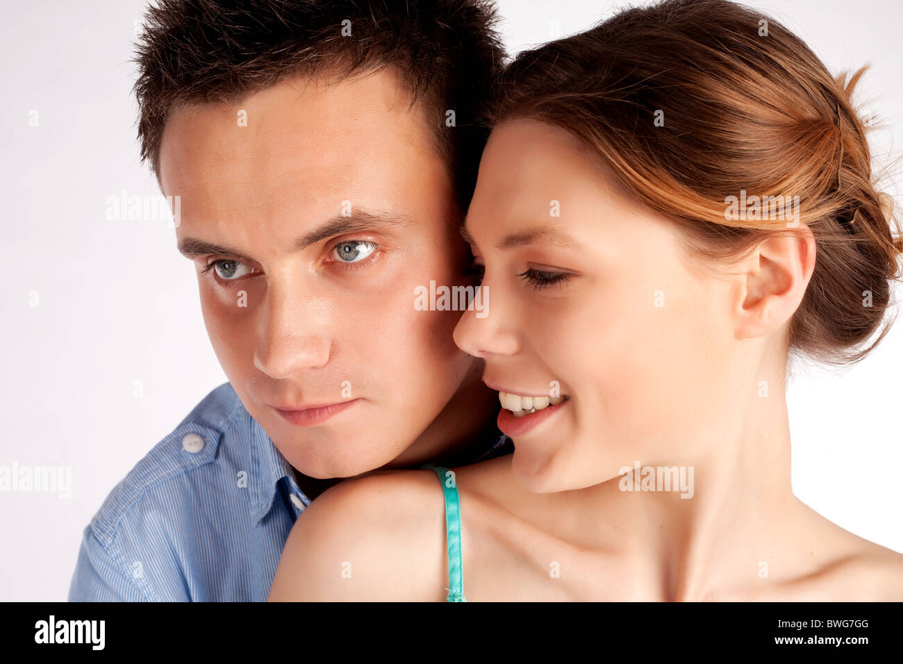 Happy young couple in love portrait isolated over a white background ...