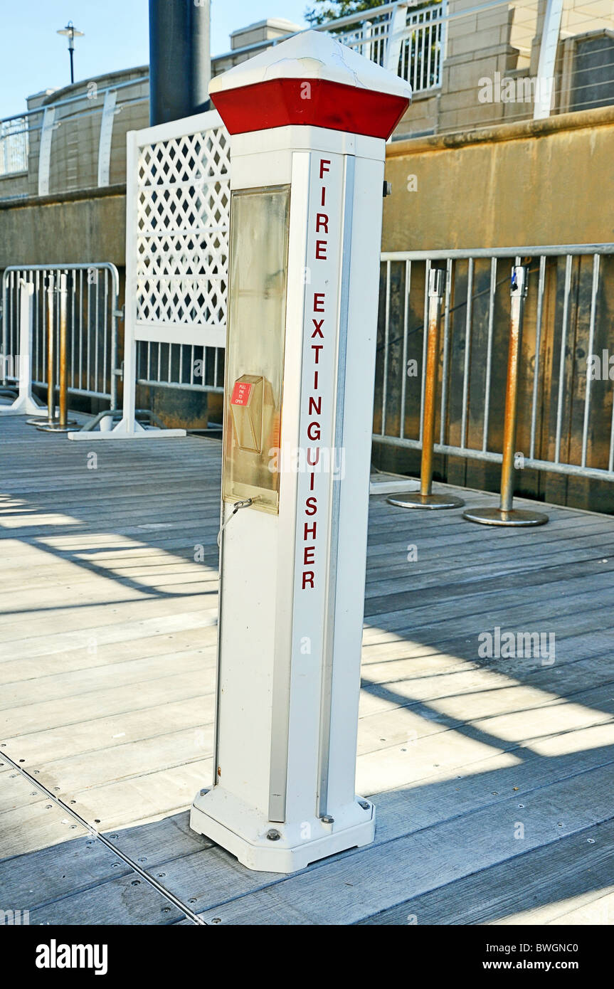Fire extinguisher on boat dock Stock Photo