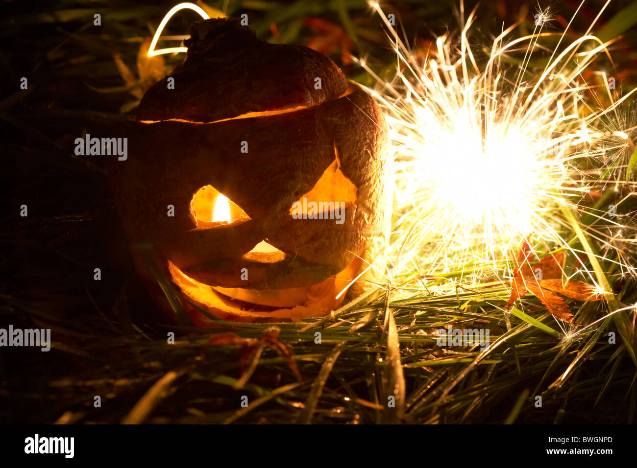 illuminated halloween turnip jackolantern with sparkler to ward off