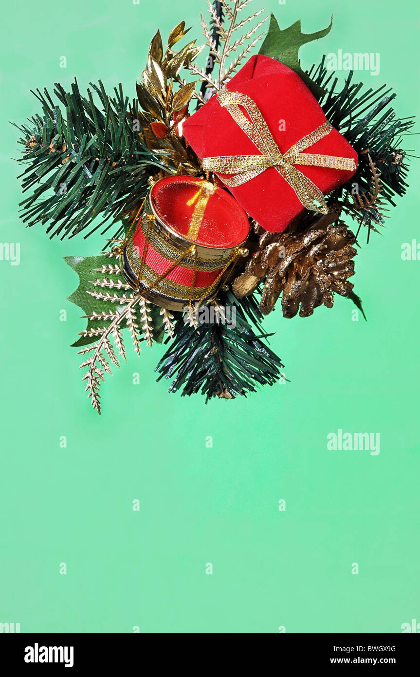 Hanging Christmas ornament isolated on green background with copy space. Stock Photo