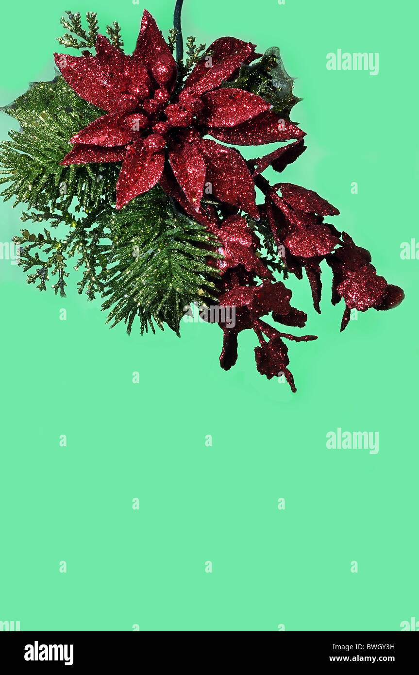 Hanging Christmas ornament isolated on green background with copy space. Stock Photo
