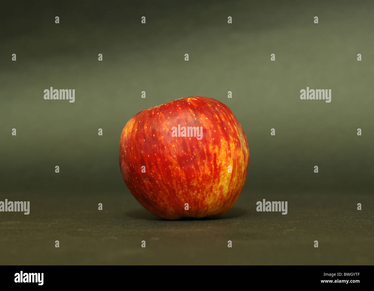 Red apple in gradient background Stock Photo Alamy