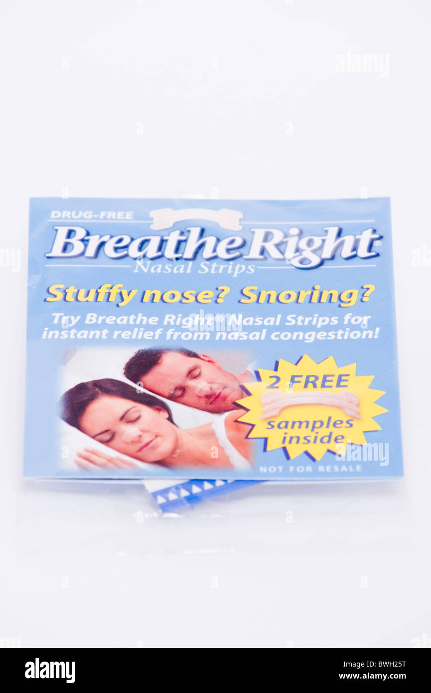 A pack of Breathe Right nasal strips to stop snoring and relieve stuffy noses on a white background Stock Photo