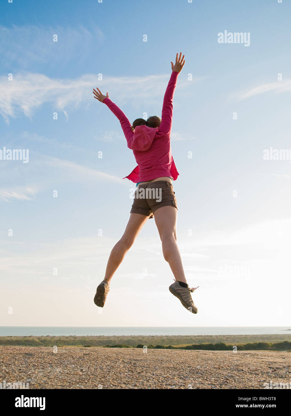 Hiker jumps into the air hi-res stock photography and images - Alamy