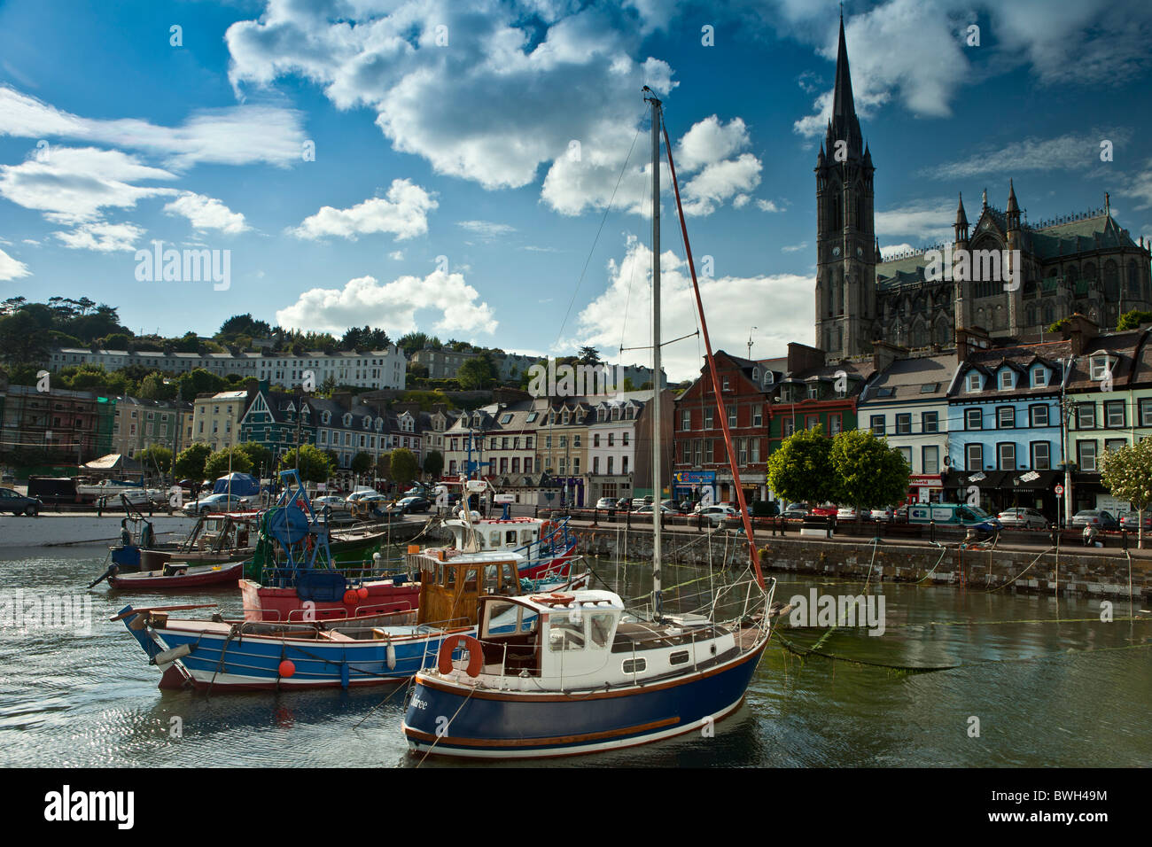 Popular as a tourist destination Cobh harbour with brightly coloured fishing boats in County Cork, Ireland Stock Photo