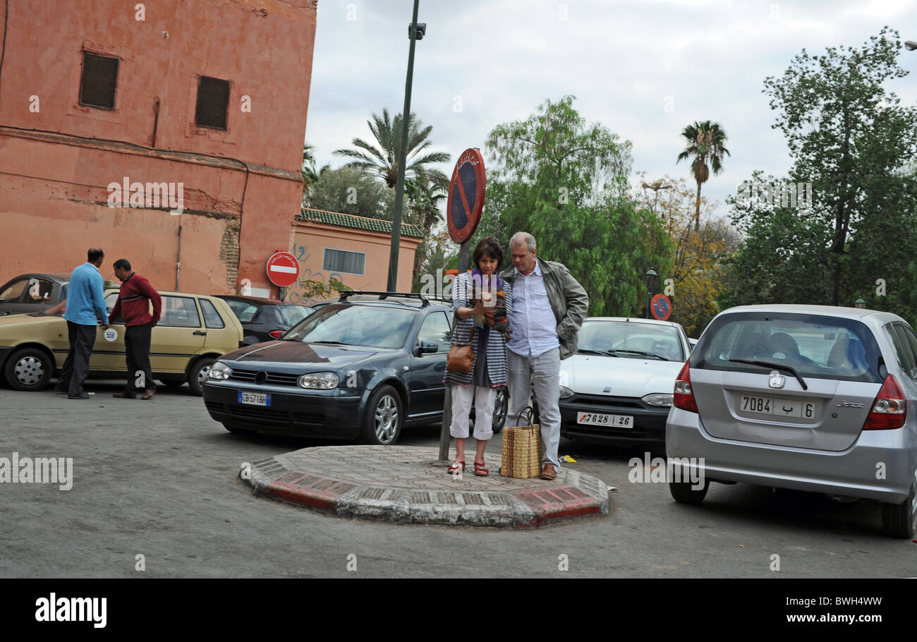 Marrakesh Morocco 2010 - Tourists looking lost check out a map for directions in the centre of Marrakech Stock Photo