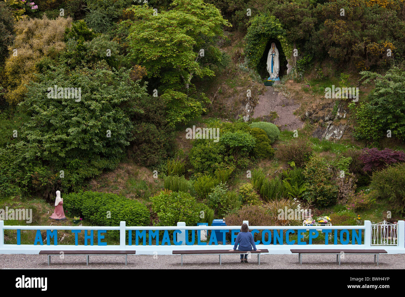 Pilgrim at Grotto of the Virgin Mary and The Immaculate Conception at