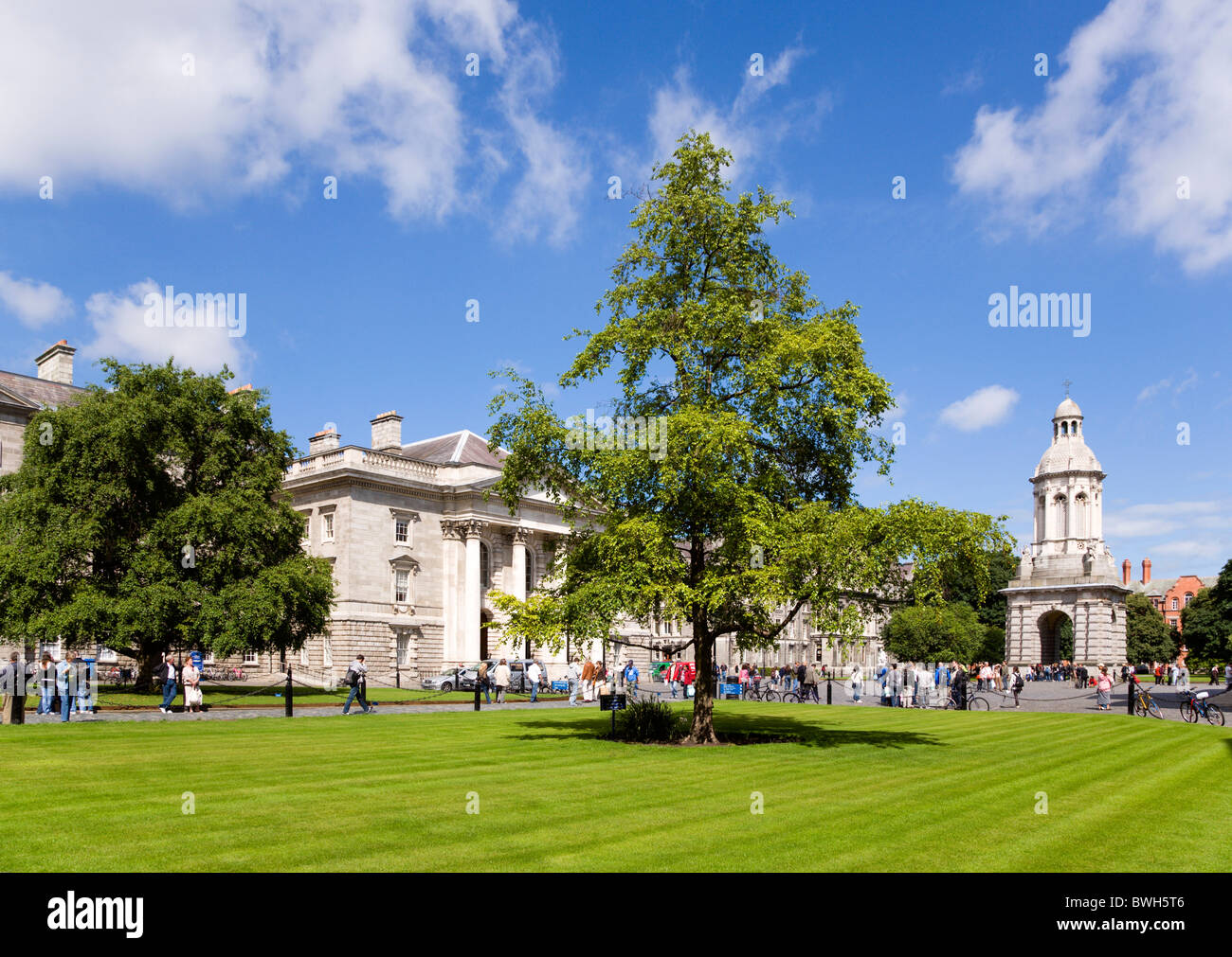 Ireland County Dublin City Trinity College university with people walking through Parliament Square towards Campanile Stock Photo