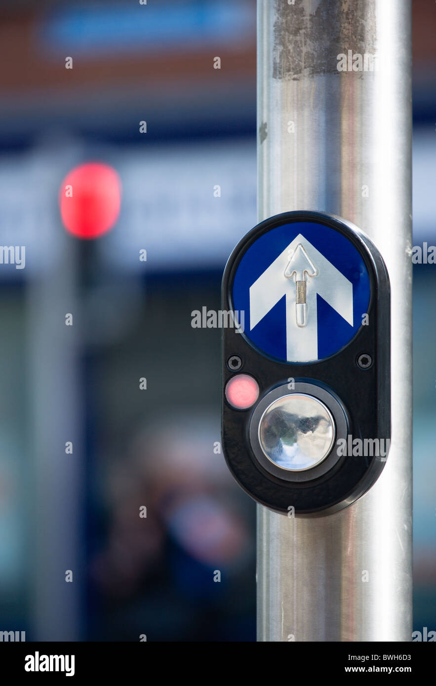 Ireland, County Dublin, Dublin City, Traffic light controlled pedestrian crossing button with halt red light and direction arrow Stock Photo