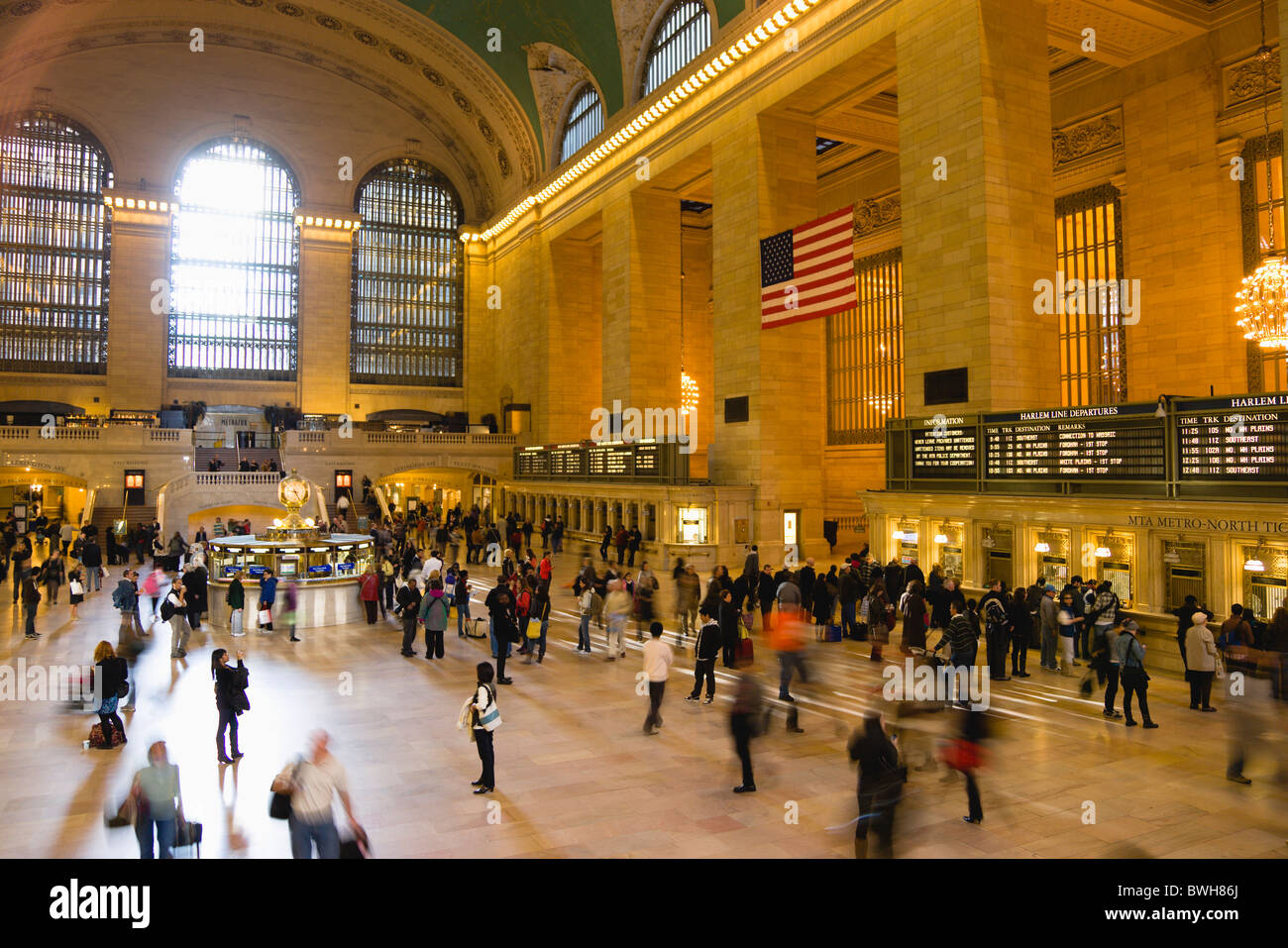 USA New York Manhattan NYC Grand Central Terminal railway station with people walking in Main Concourse and buying tickets Stock Photo