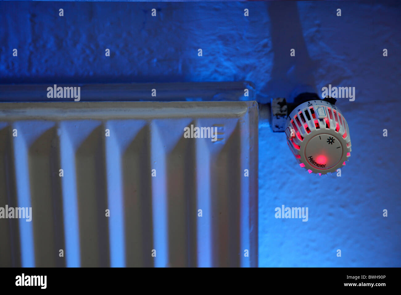 Illuminated radiator, thermostat, central heating in a private house