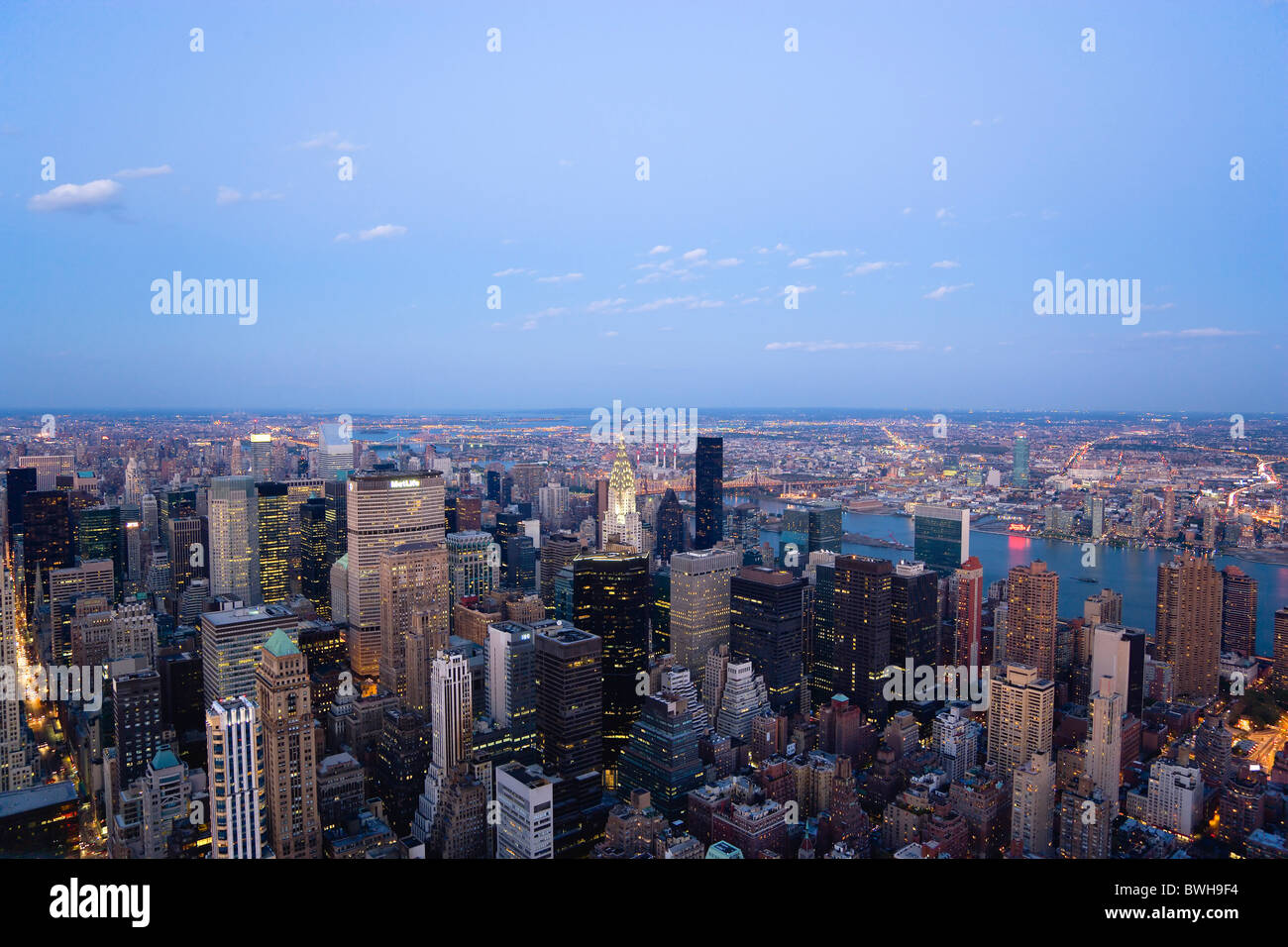 USA, New York, Manhattan, View over midtown skyscrapers and East River towards Queens and Long Island at sunset Stock Photo