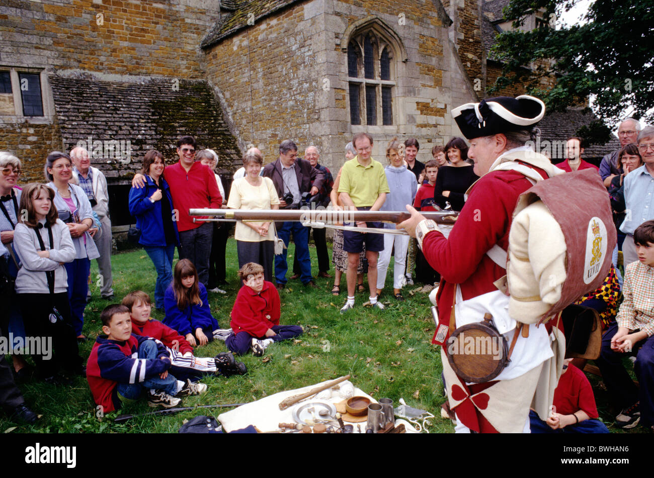 Historical re-enactment, 47th Regiment of Foot, demonstration re-enactor demonstrating English British military life to audience Stock Photo