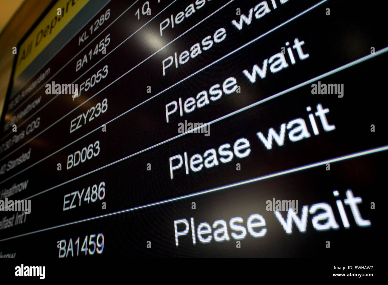 Airport departures information screen with all flights on please wait Stock Photo