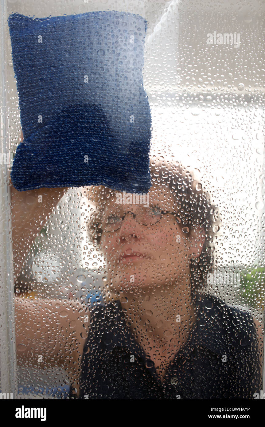 Woman cleaning bathroom shower Stock Photo Alamy