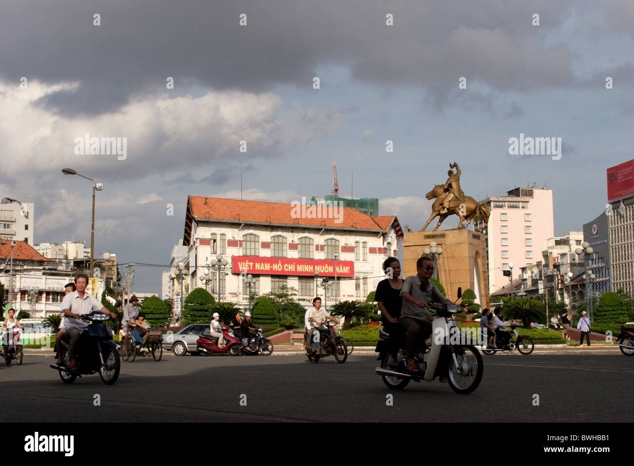 A group of people are driving their motorcycles in Saigon (Ho Chi Minh City) Vietnam. Stock Photo