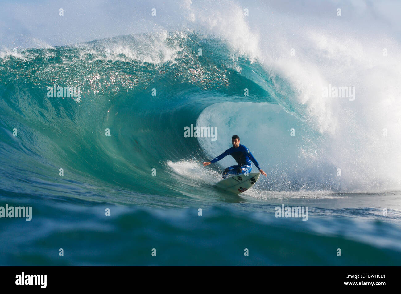 Surfer in the tube of large wave Stock Photo