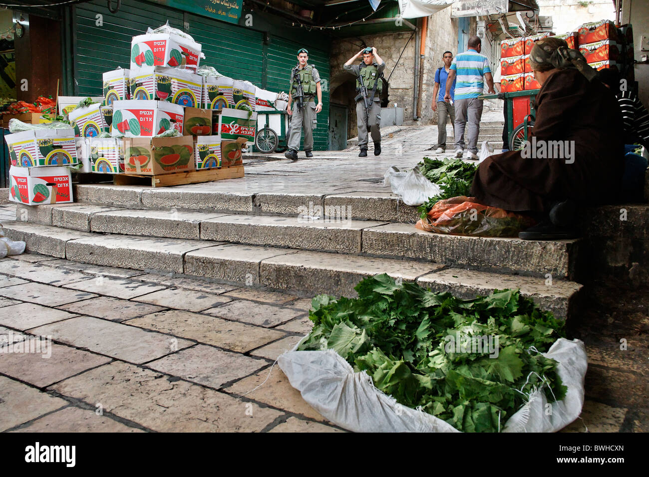 A palestinian woman selling vine leaf at the market of the old city of Jerusalem Israel Stock Photo