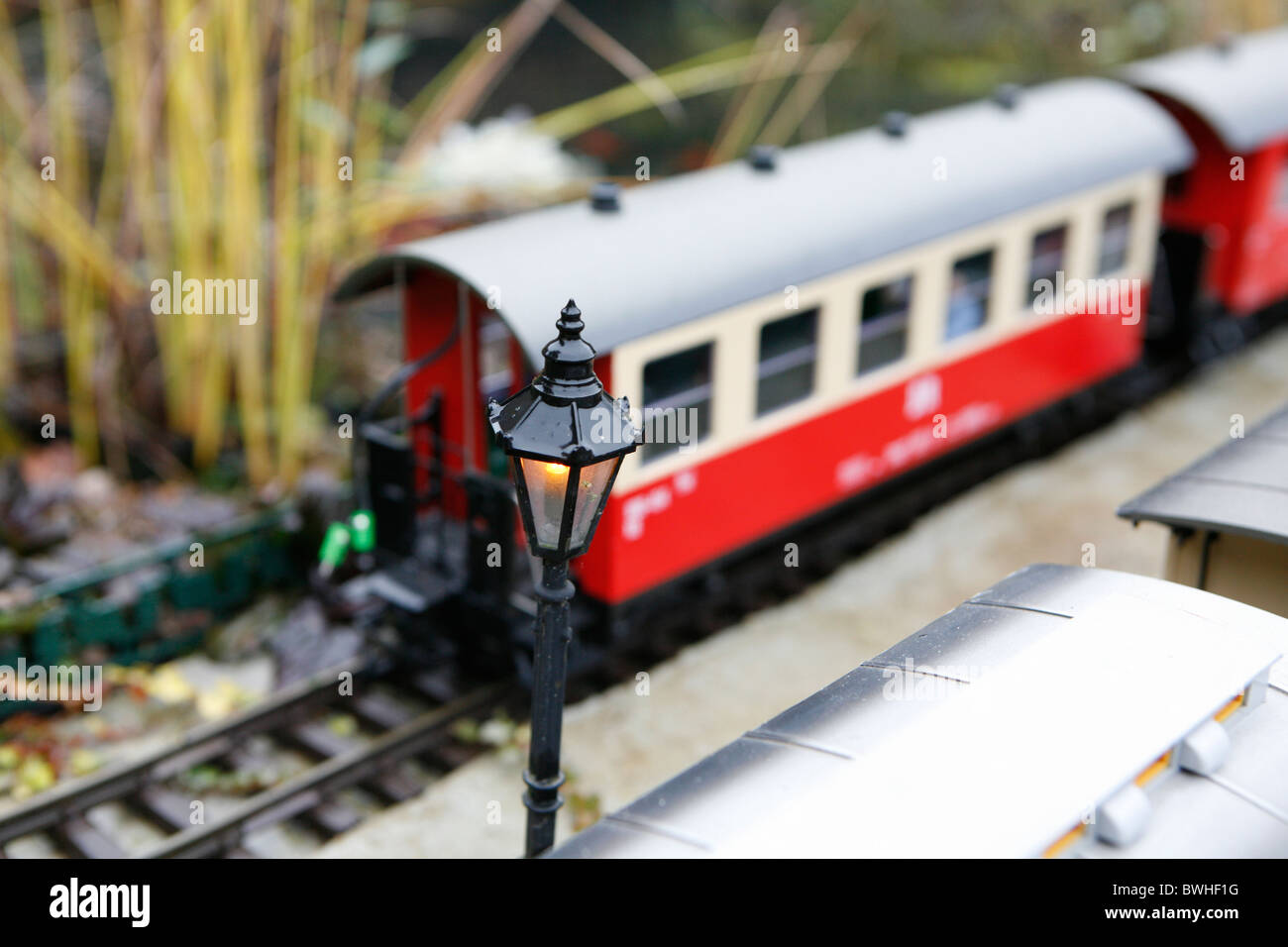 Model train and locomotive in landscape. Stock Photo