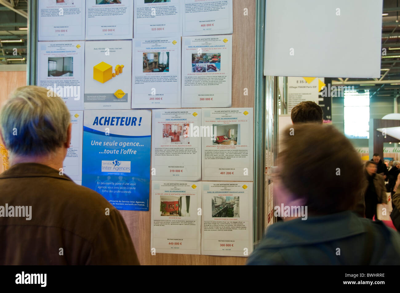 Paris, France Senior Couple Reading House Sales Ads, Interior Paris