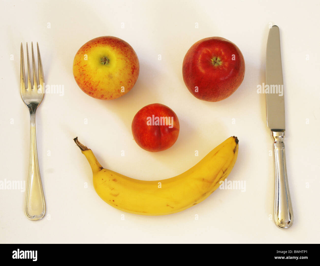 healthy healthy food feeding fruit apple apples banana diet knife fork food meal starve respect esteem Stock Photo