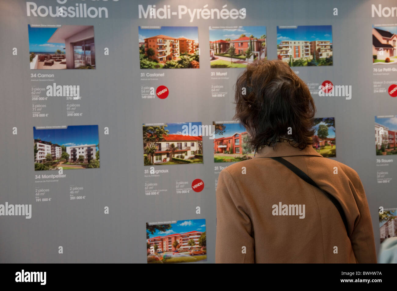 Paris, France Senior Woman Reading House Sales Ads, Interior Paris
