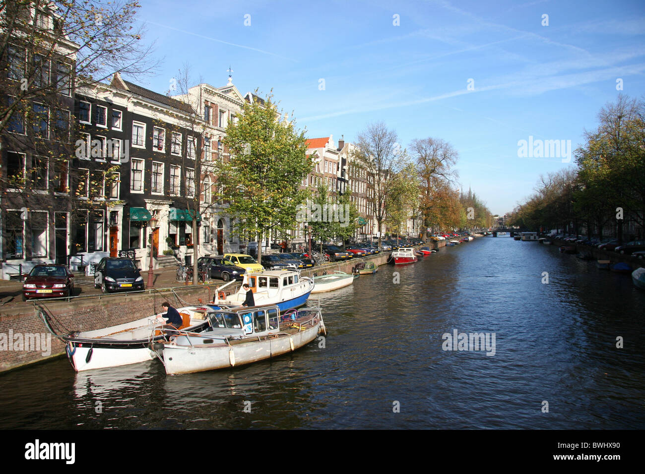 Holland Netherlands Holland Europe Amsterdam Gracht canal canal boats water row of houses shore trees Stock Photo