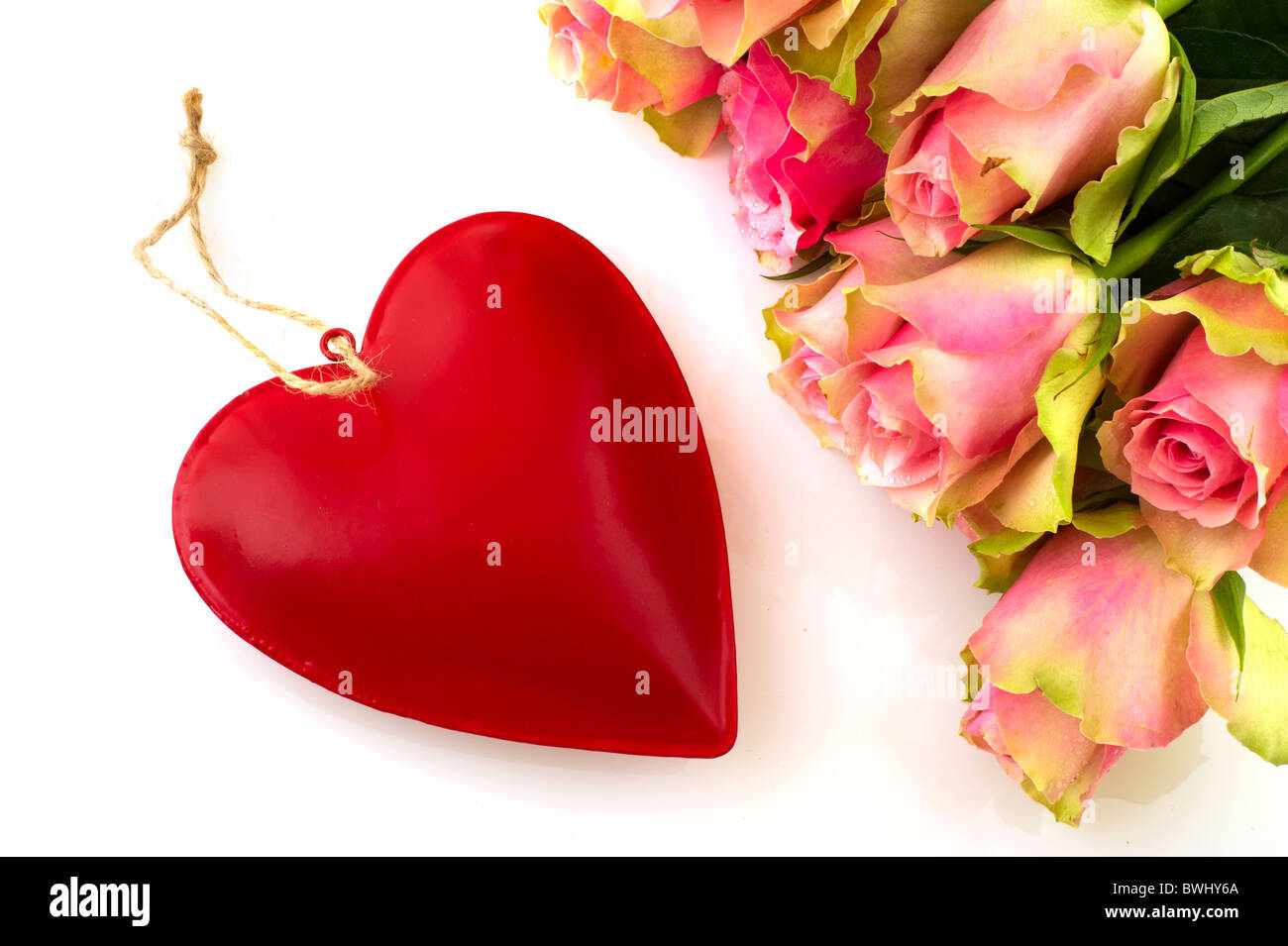 Bouquet beautiful pink roses with red heart isolated over white Stock ...