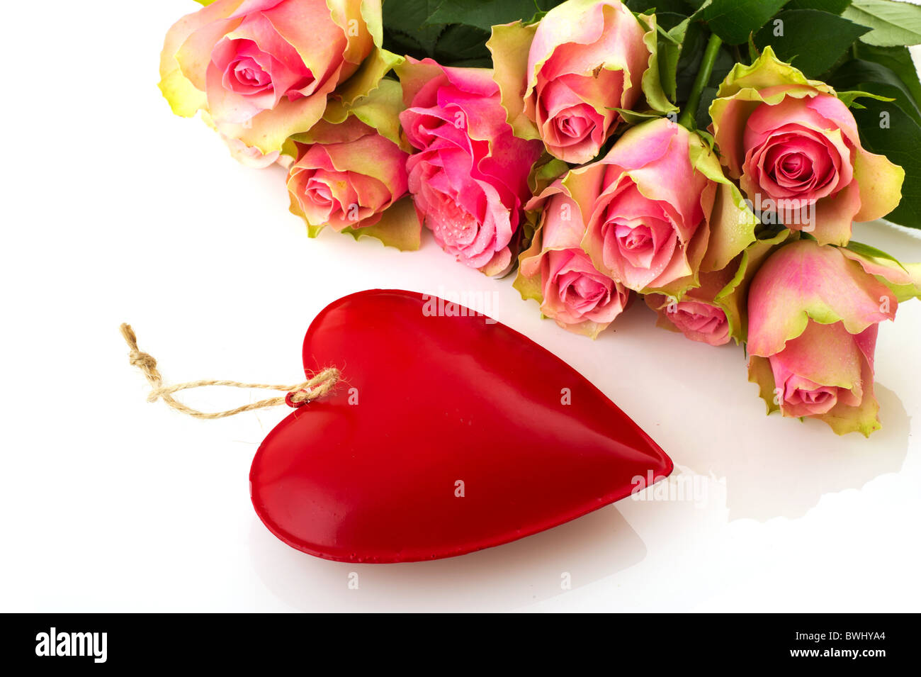 Bouquet beautiful pink roses with red heart isolated over white Stock ...