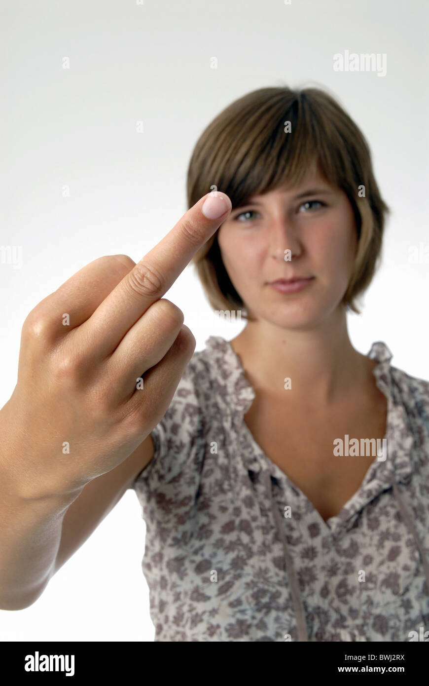 fuck you young woman young girl teenager youngsters gesture rebellious finger hand Stock Photo