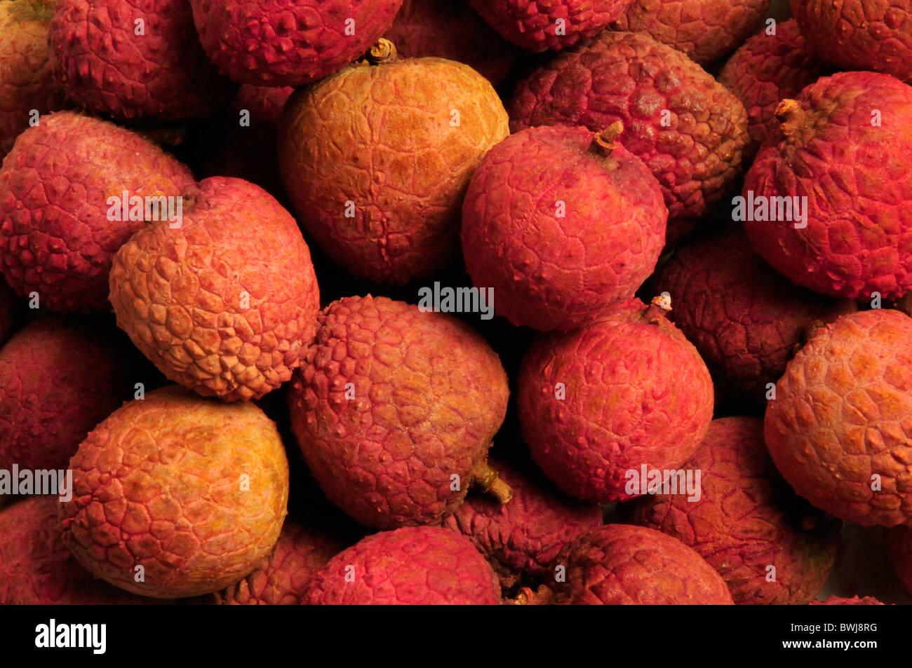 Red and orange Chinese lychee fruit Stock Photo
