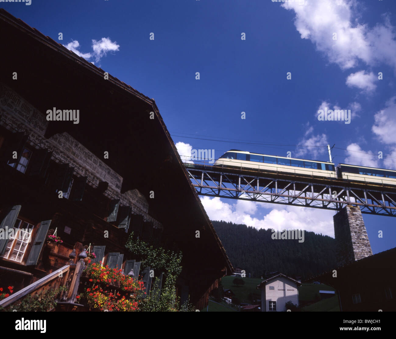 Crystal Panoramic Express train railroad Gstaad chalet timber house ...