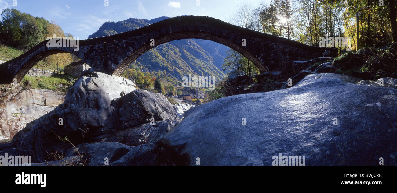 Lavertezzo Verzasca bridge stone bridge rock cliff river scenery landscape canton Ticino Switzerland Europe Stock Photo