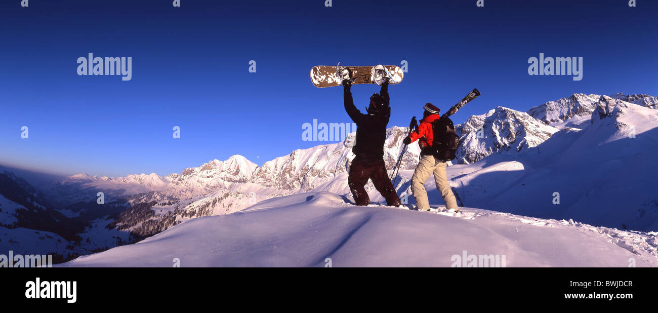 two persons ski drivers Snowboarder cheering joy snowboard ski skiing winter winter sports deep snow snow Stock Photo