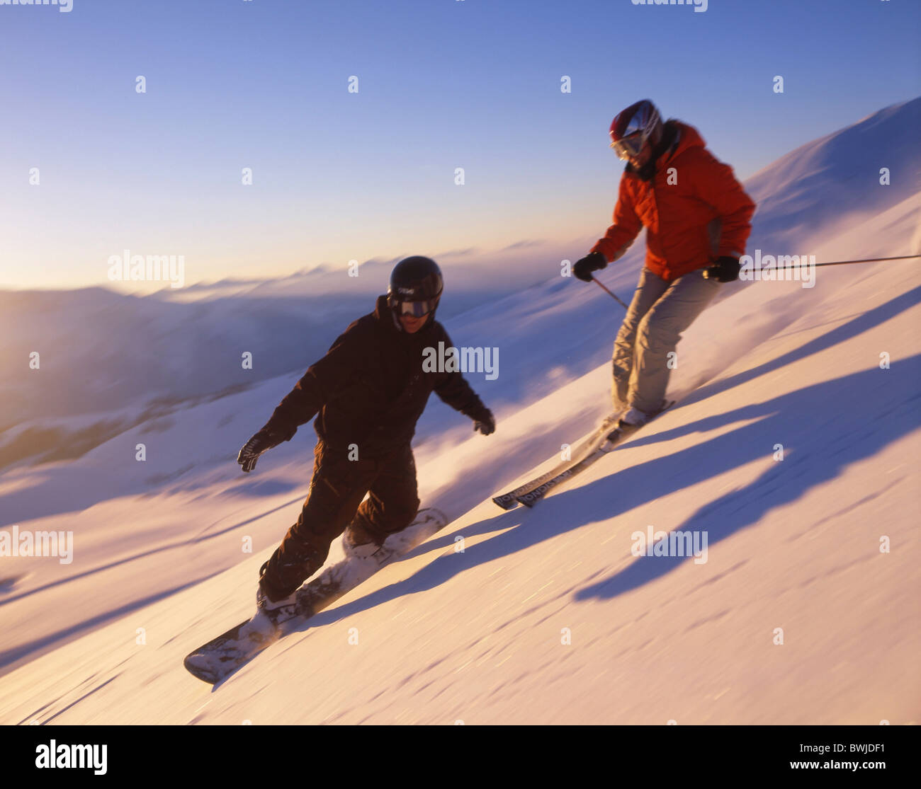 two persons Snowboarder snowboard Snowboarding ski skier skiing winter winter sports deep snow snow sports Stock Photo