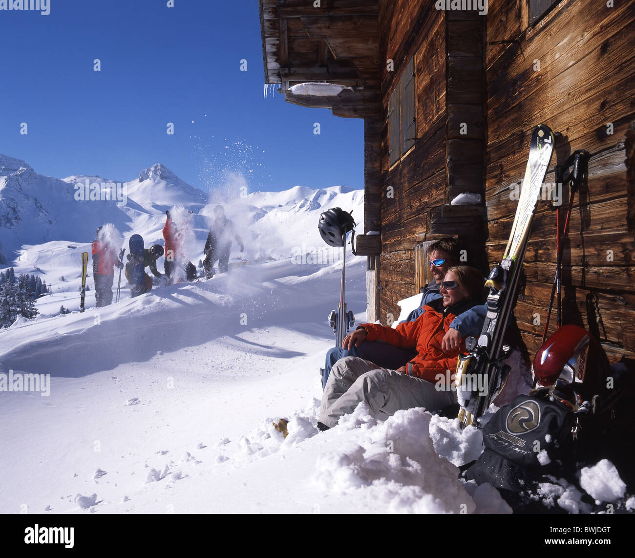 couple two persons relax relaxed suns sunbath tanning alpine cabin hut holidays vacation summer cottage c Stock Photo