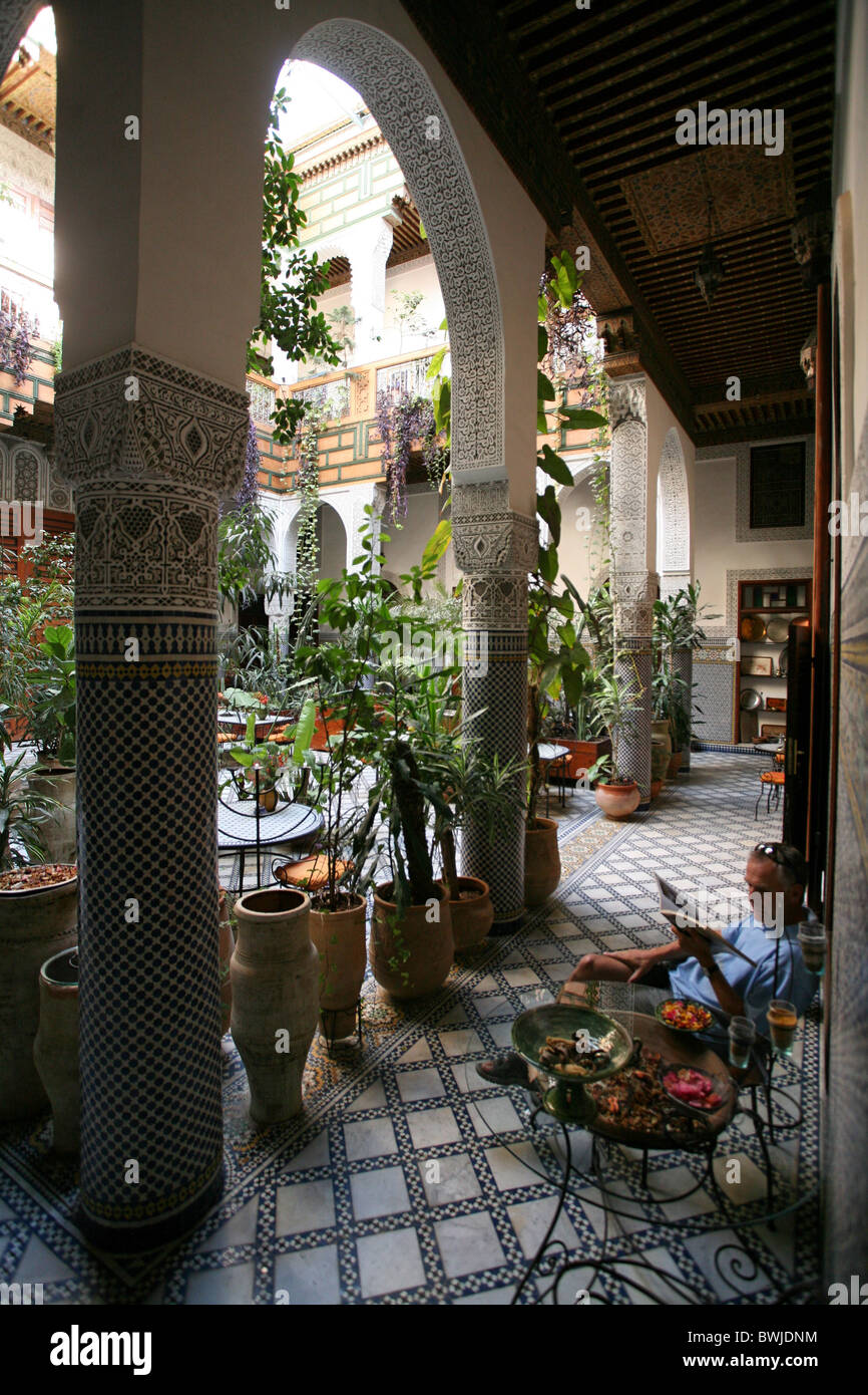 hotel inner courtyard oriental East plants tourism Fez Marrokko Africa Stock Photo