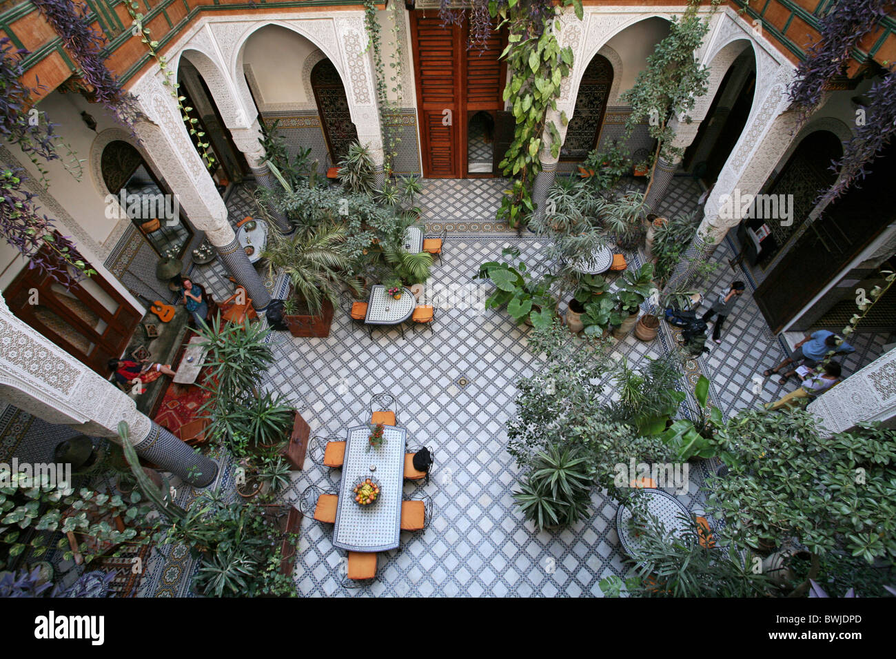 hotel inner courtyard oriental East plants tourism Fez Marrokko Africa Stock Photo