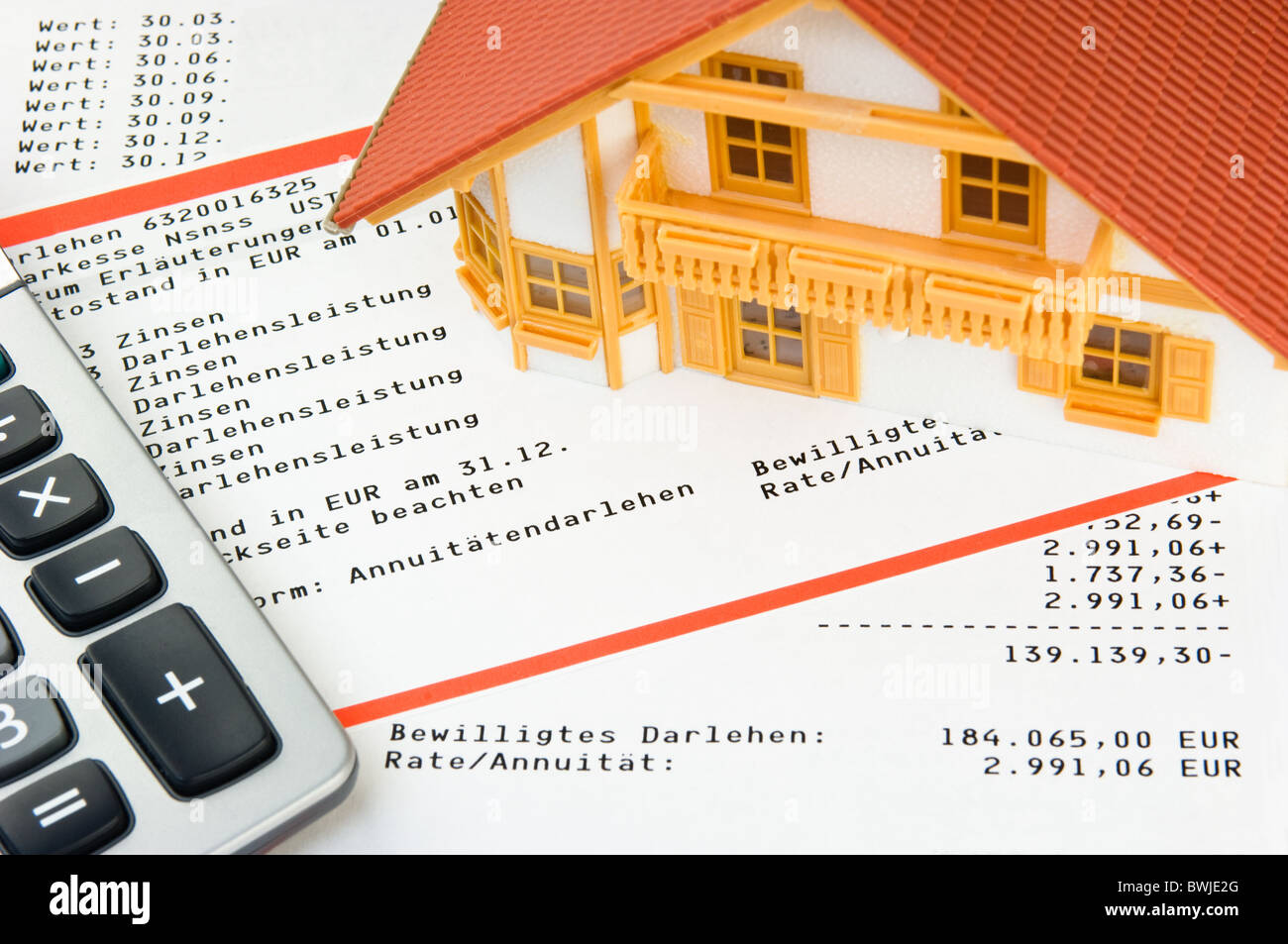 Model house on loans account statement Stock Photo