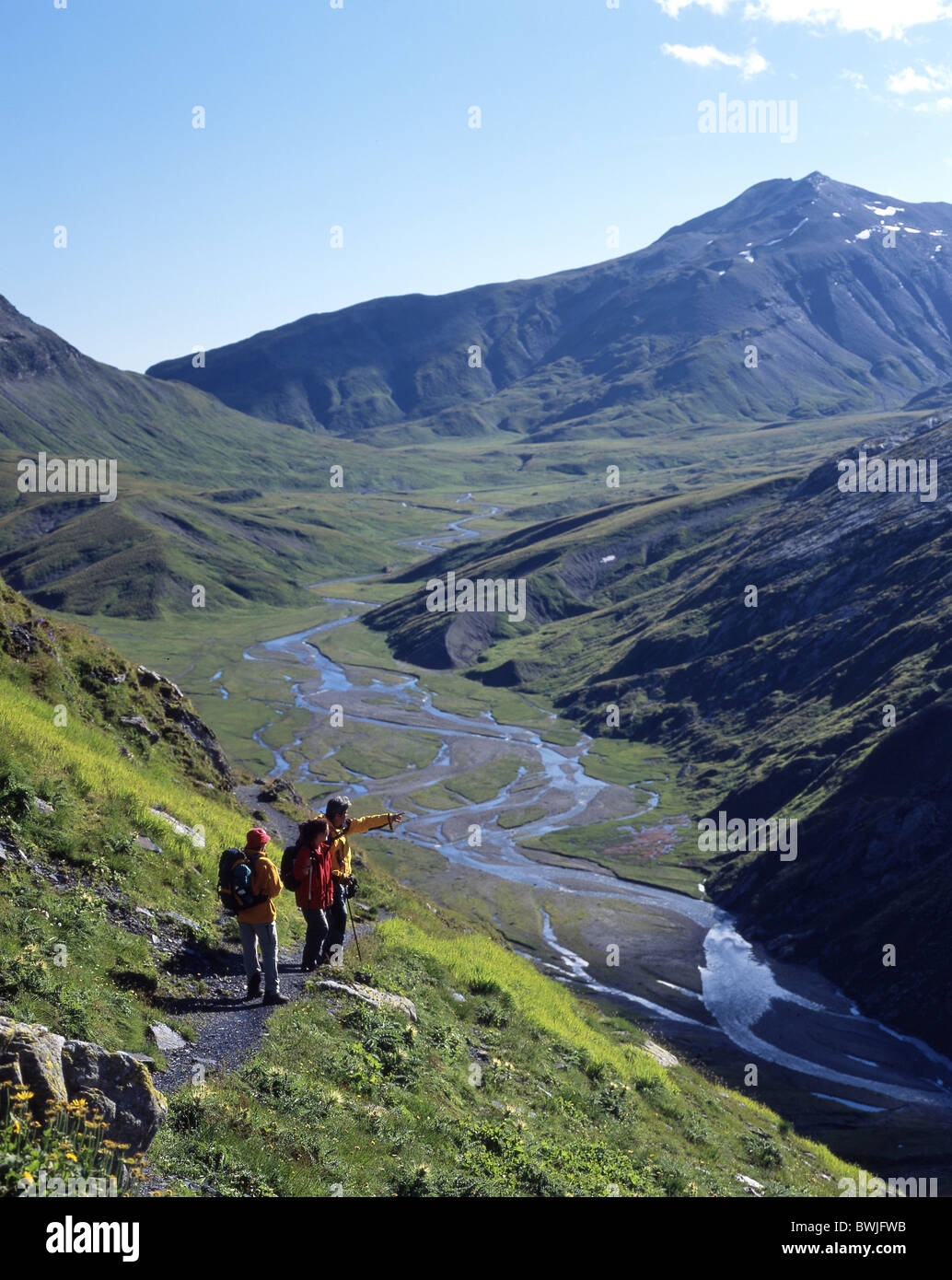 Greina level plain group traveller walking hiking mountain walking scenery landscape mountains Alps Grisons Stock Photo